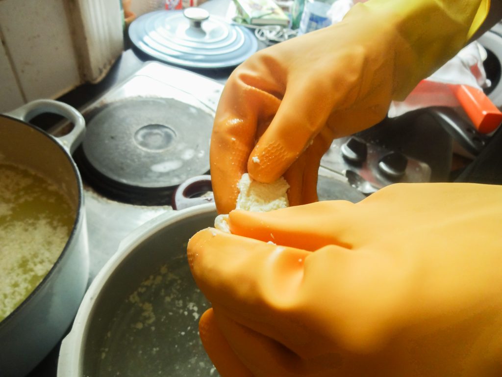 After heating the curds, the mozerella needed to be stretched, really quickly, but it was too hot to touch even with our sexy marigolds.